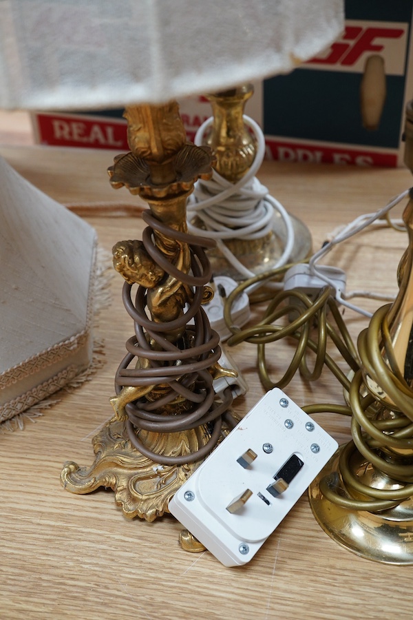 A figurative gilt metal table lamp, five brass table lamps and an alabaster lamp, tallest 35cm high. Condition - one poor, the others fair to good